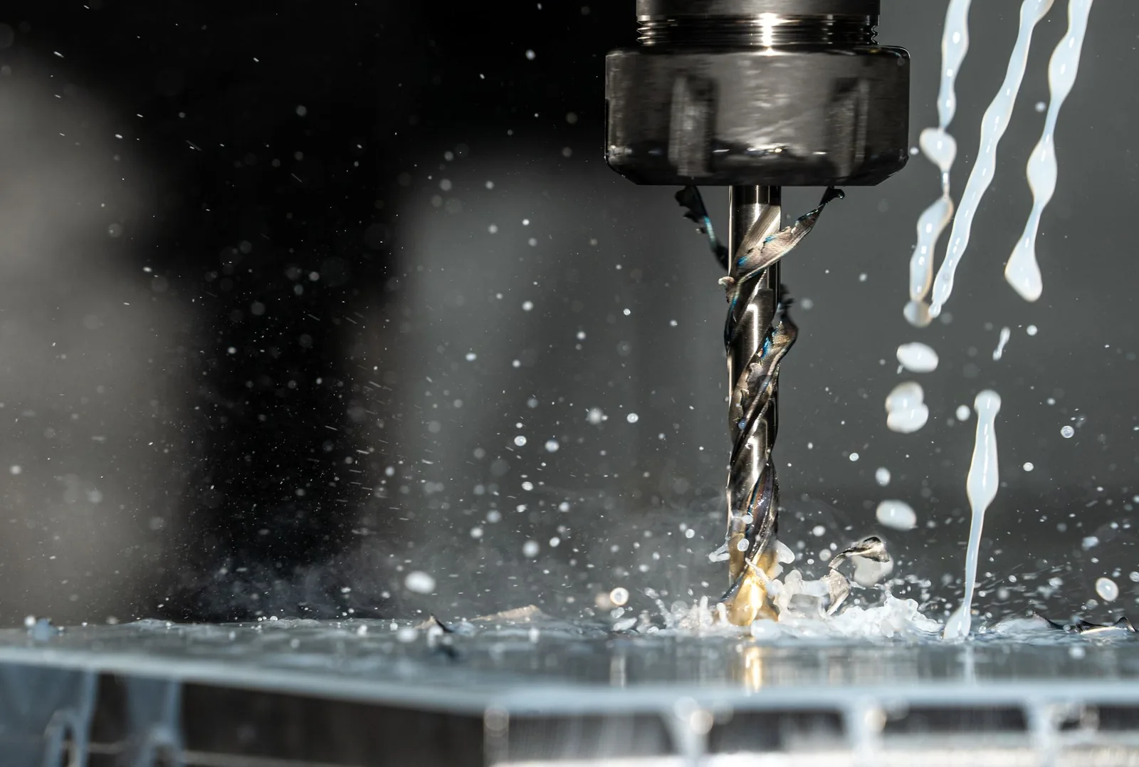 CNC milling machine with coolant spray during precision metalwork