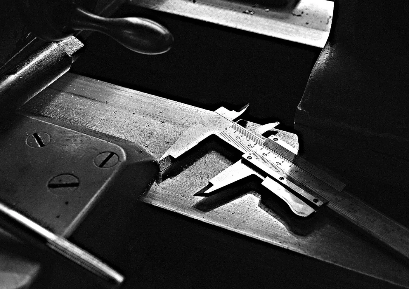 Precision caliper tool in black and white close-up